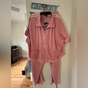 Ashley Stewart Pink with white side stripes track suit.